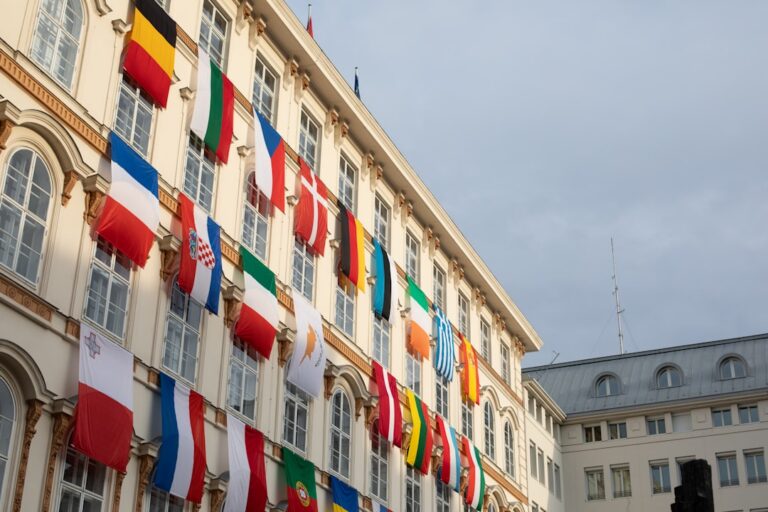 International flags on a building facade, representing expedited FBI apostille for documents going abroad
