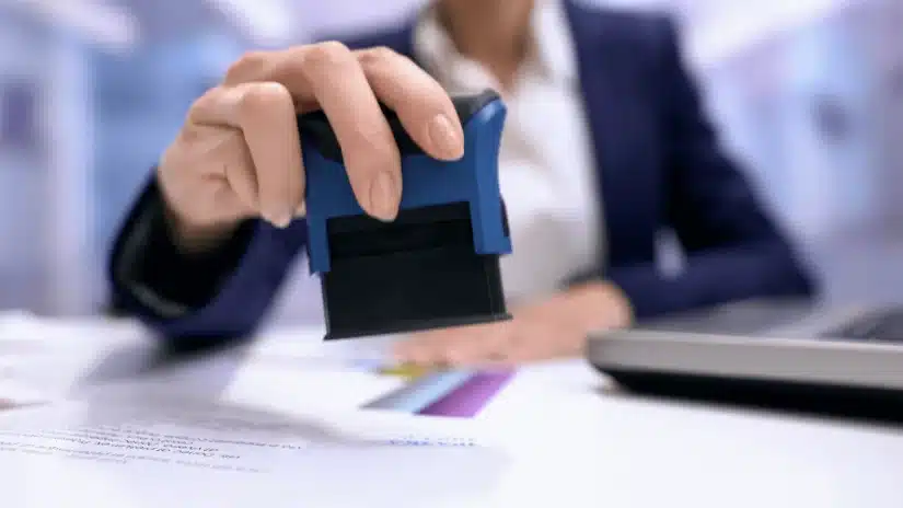 California notary stamping a sworn statement for a vital record amendment application