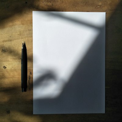 Black pen resting on a white sworn statement ready for notarized signature