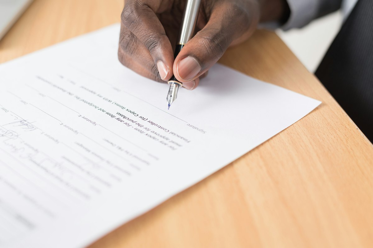 Person reviewing unsigned estate planning documents before a notary appointment in San Jose